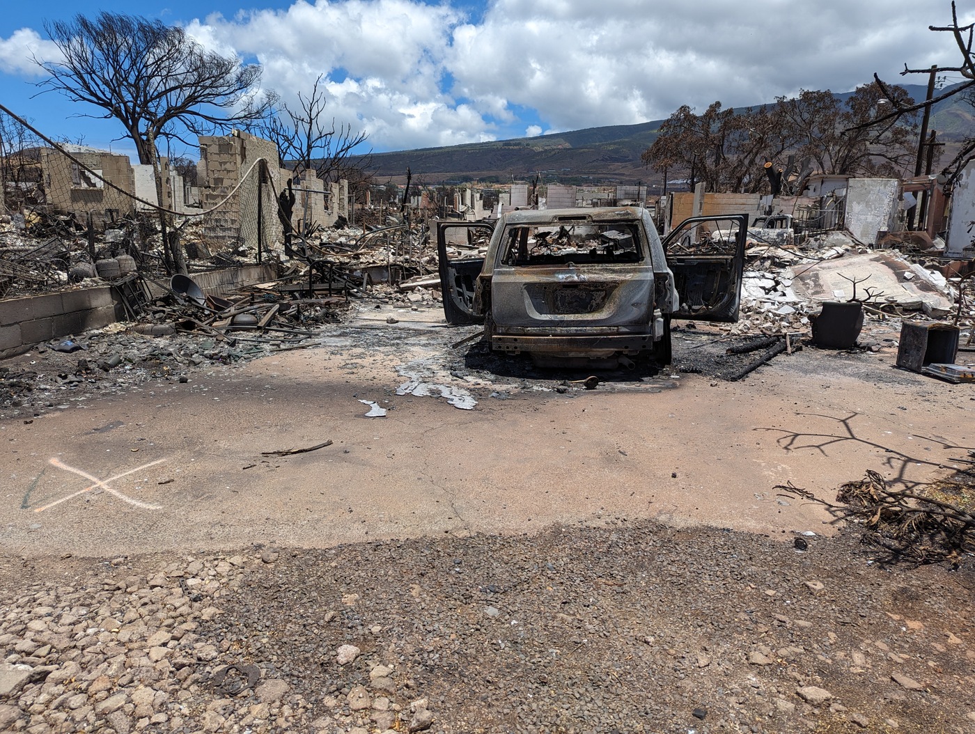 Photo of burned car in Lahaina following wildfire on August 8, 2023