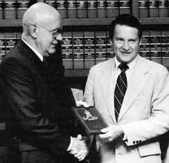 Lou Peters, left, receives an award from FBI Director William Webster in 1980.