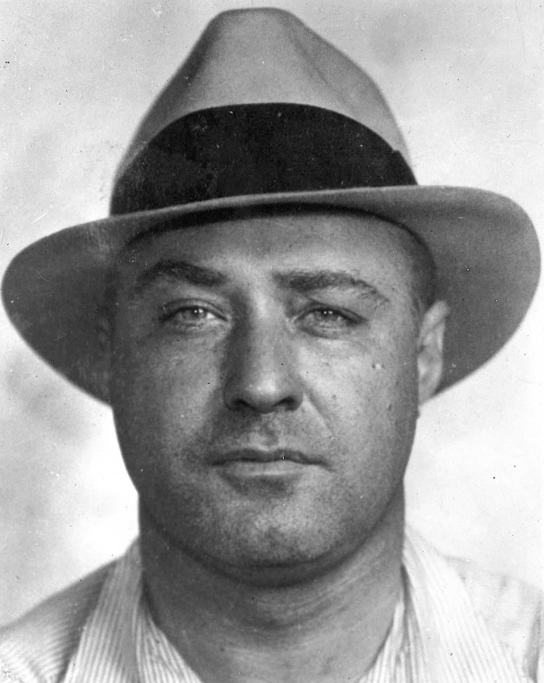 Mugshot of George "Machine Gun" Kelly (real name George Barnes), gangster and kidnapper who reportedly said "Don't shoot, G-men" when arrested in Memphis in 1933.