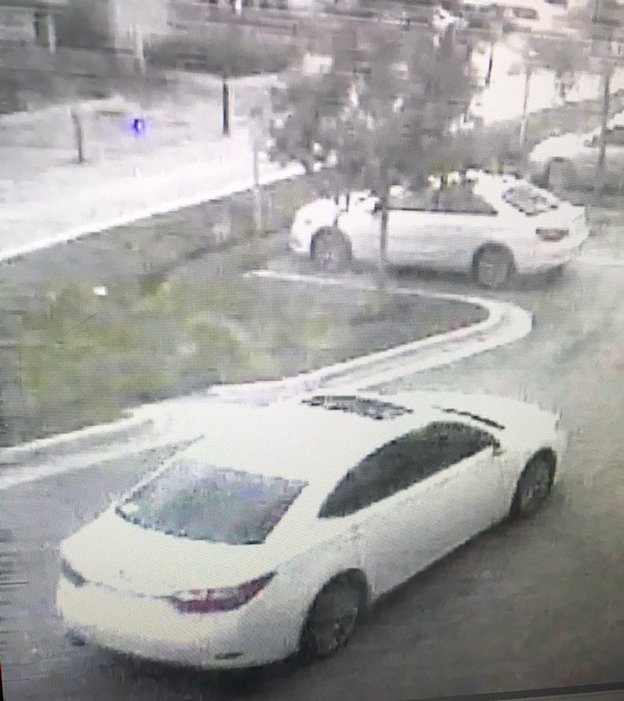 White, four-door Lexus used in the robbery of a Garda armored car making a courier stop in front of the American Signature Furniture store at the Sawgrass Mills Mall at 12801 W Sunrise Blvd. on August 2, 2016.