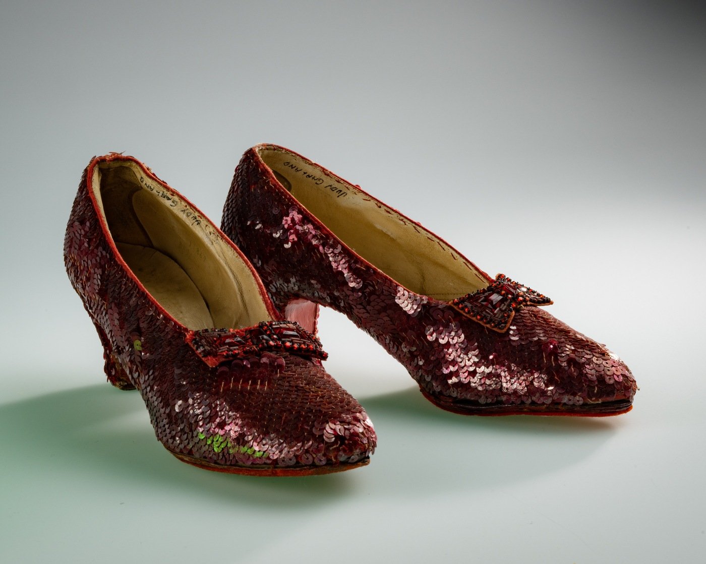 This is a close-up photo of the so-called "traveling pair" of iconic sequined shoes—one of at least four pairs used in "The Wizard of Oz" that are still in existence—that were recently returned to their owner, Michael Shaw, in an emotional reunion.