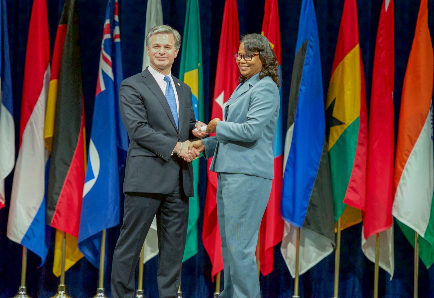Sherlet Ramclam, an inspector for the Belize Police Department, with FBI Director Christopher Wray at the National Academy graduation on June 7, 2019.