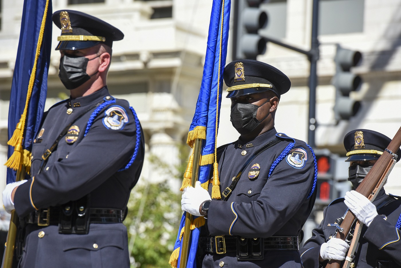 Officers carry flags outside of the annual Blue Mass in Washington, D.C. on Sept. 29, 2021. 