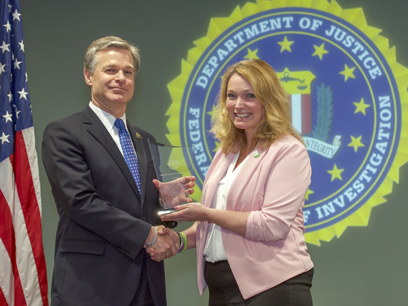 FBI Director Christopher Wray presents New Haven Division recipient Sandy Hook Promise (represented by Nicole Hockley) with the Director’s Community Leadership Award (DCLA) at a ceremony at FBI Headquarters on May 3, 2019.
