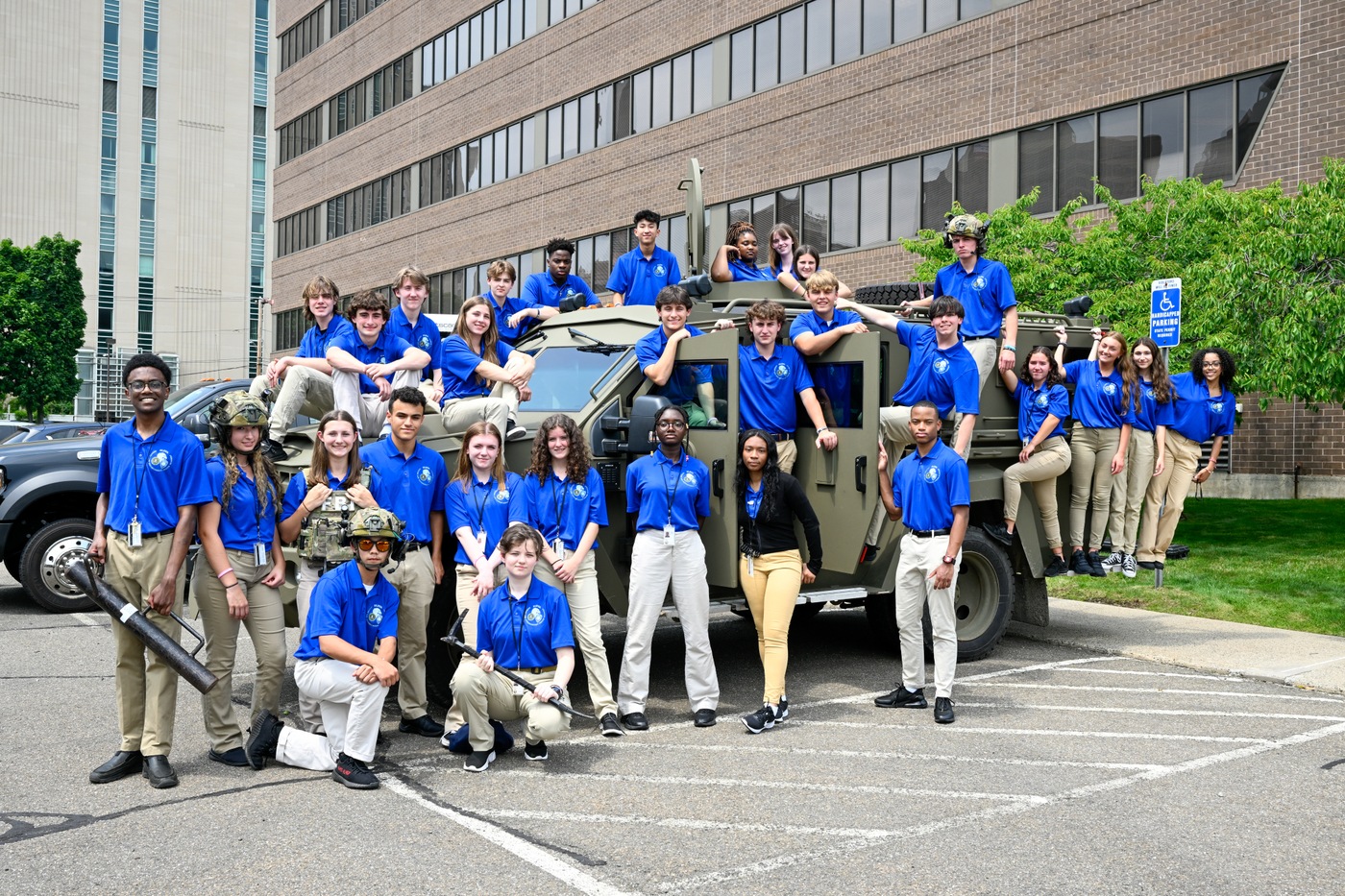 Class photos of students from the 2023 New Haven FLEYA standing with an FBI vehicle.