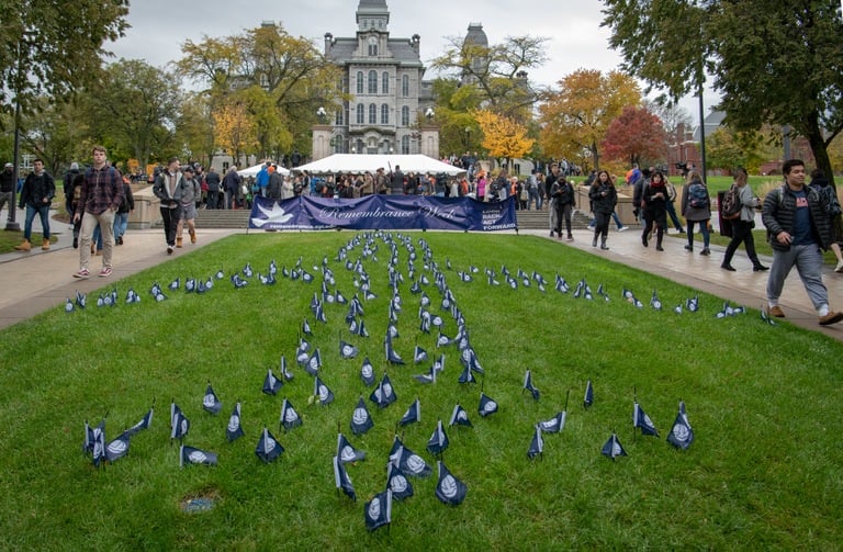 Flags in the ground are arranged in the pattern of an airplane during the 2018 Remembrance Week at Syracuse University, where the school marks the deaths of 35 of its students who were killed in the December 21, 1988 bombing of Pan Am Flight 103 over Lockerbie, Scotland.