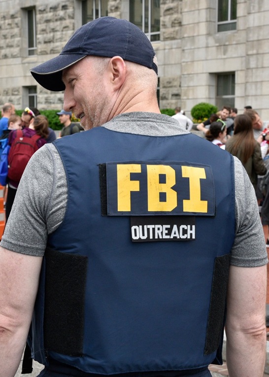 An FBI employee wears an outreach vest at the National Police Week 5K on May 11, 2019, in Washington, D.C.