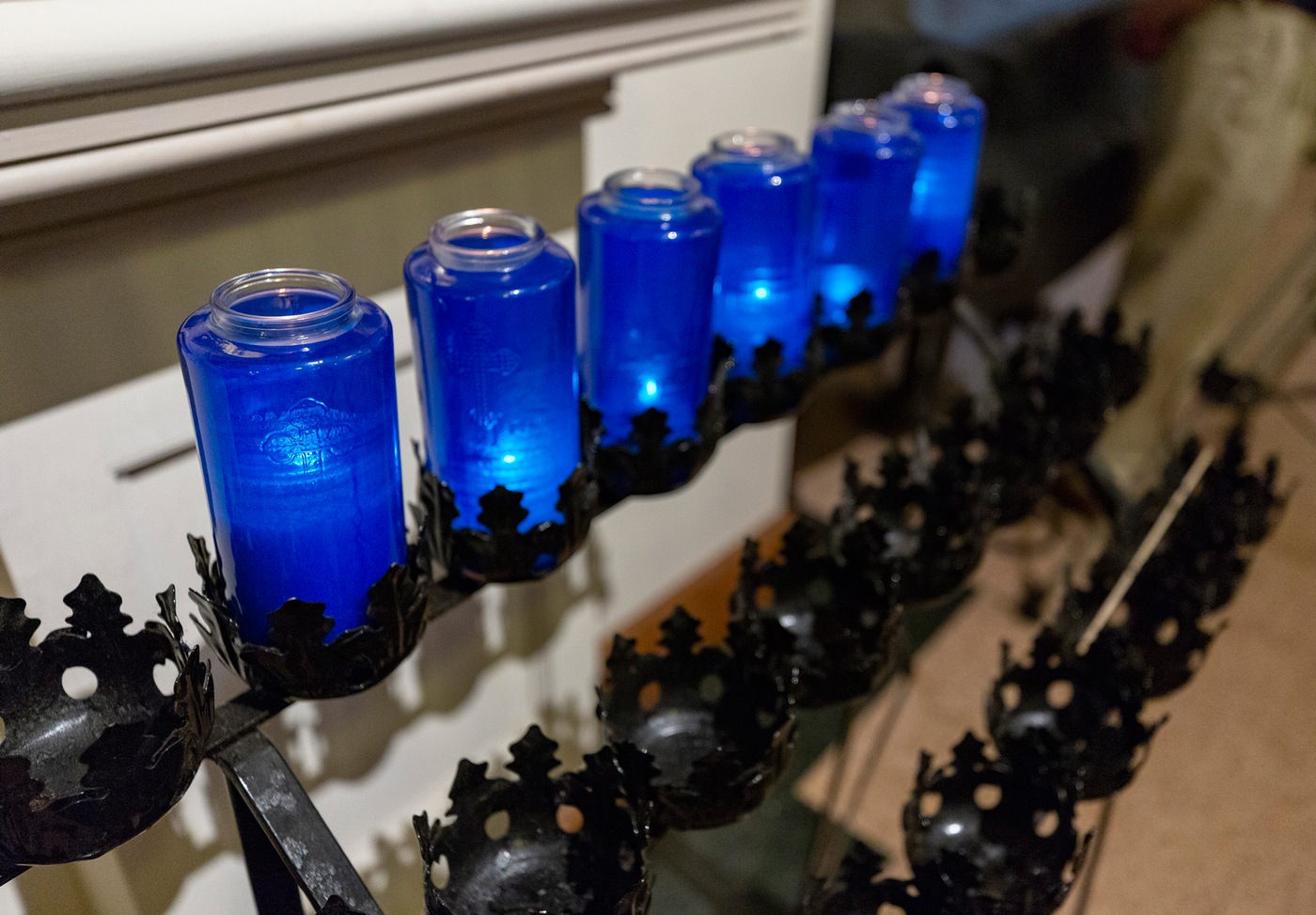 Candles are lit on May 7, 2019, at St. Patrick’s Church in Washington, D.C., as part of the annual Blue Mass observance honoring fallen officers in advance of National Police Week.