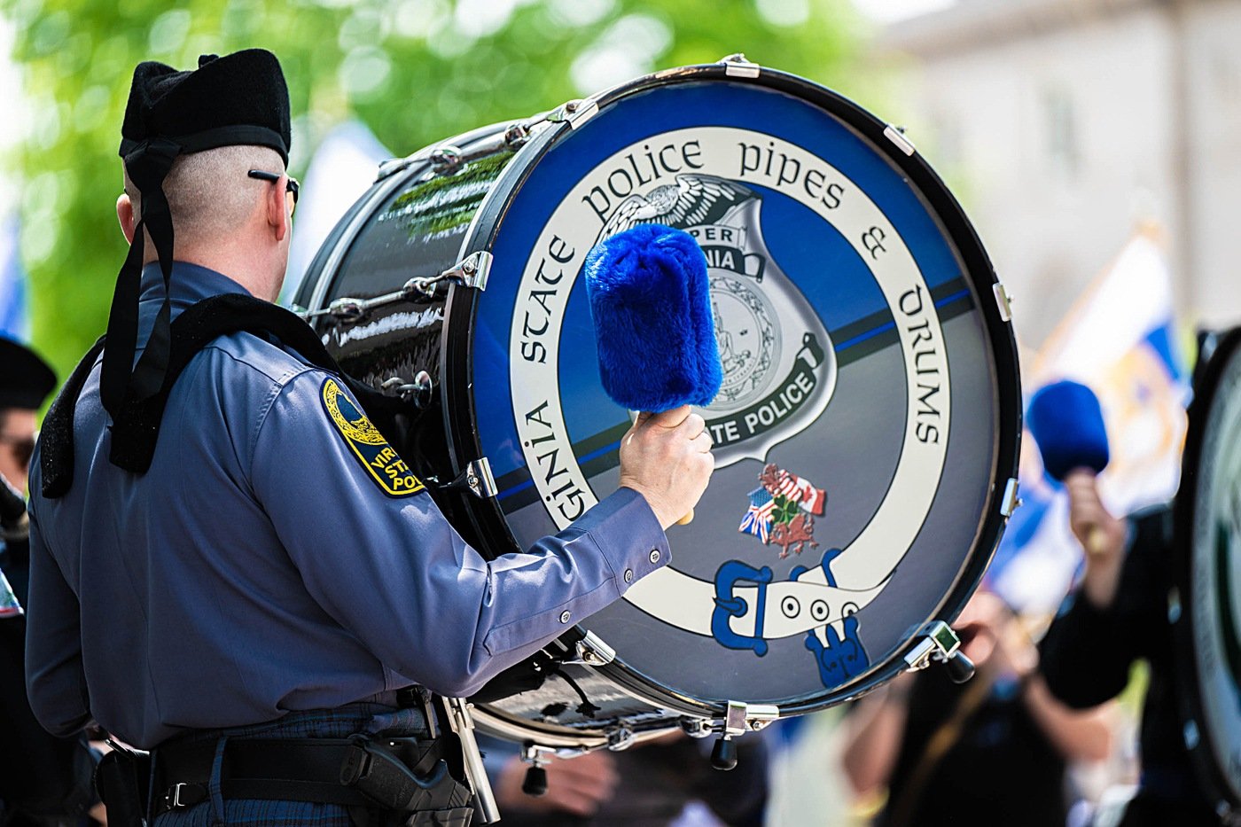 A drummer for a pipe band plays during National Police Week.