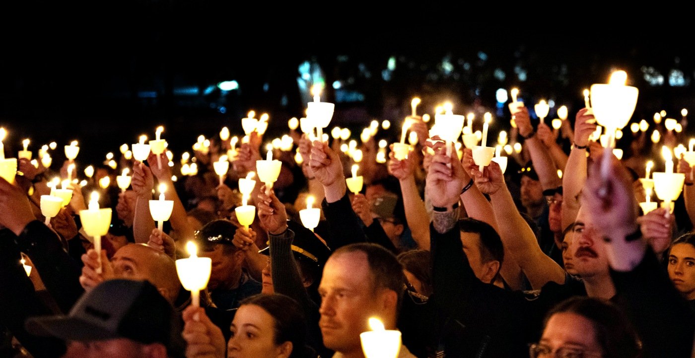 Attendees hold up candles at a vigil On May 13, 2024, on the National Mall in Washington, D.C. for National Police Week. 