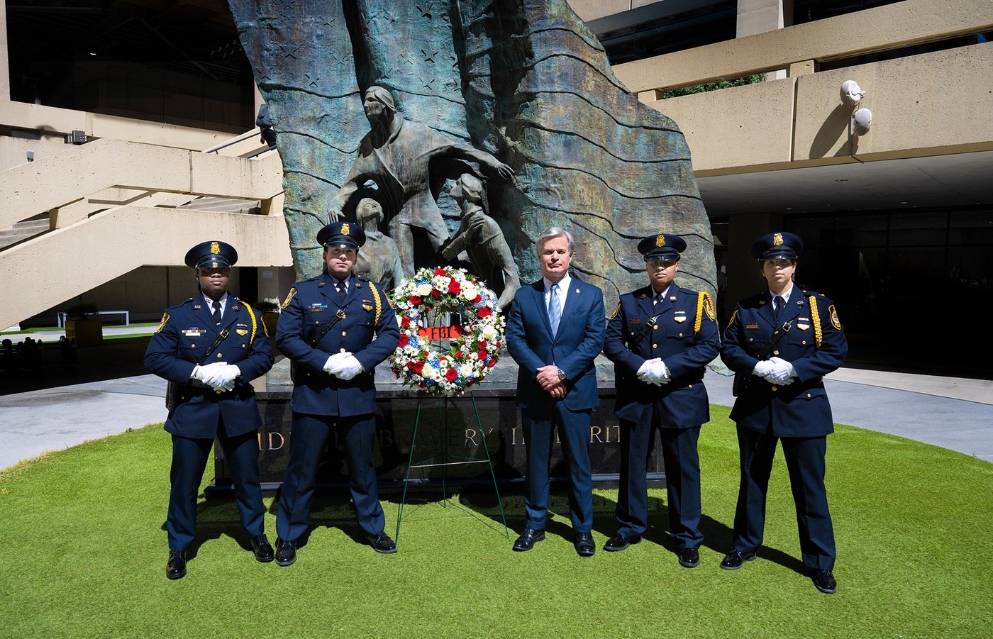 Director Wray and FBI Police during the FBI Wall of Honor memorial ceremony at FBI Headquarters on May 16, 2024 in Washington, D.C.