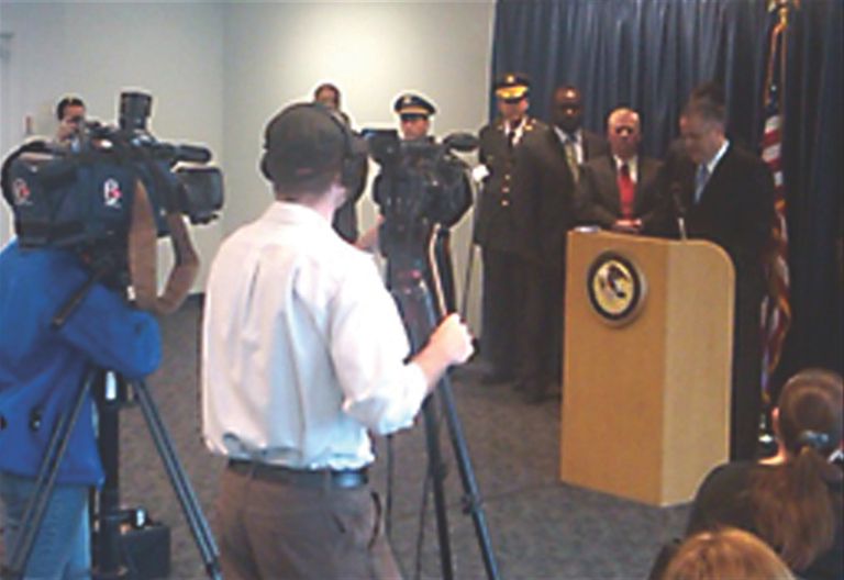 Philadelphia Special Agent in Charge George Venizelos, at podium, announces indictments of 13 members and associates of the Philadelphia La Cosa Nostra (LCN) family with racketeering, extortion, loan sharking, illegal gambling, and witness tampering in May 2011.