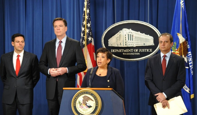 Attorney General Loretta Lynch—joined by (from left) Assistant Attorney General for National Security John Carlin, FBI Director James Comey, and U.S. Attorney Preet Bharara of the Southern District of New York—announces indictments against seven Iranian hackers for cyber crimes against the U.S. financial sector at a press conference on March 24, 2016 at the Department of Justice in Washington, D.C.