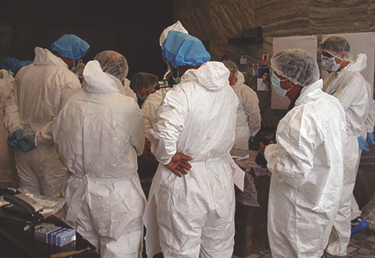 FBI personnel working in the Afghanistan legal attachA(c) work to identify the remains of victims of Pamir Airways Flight 112, which crashed in the mountains outside Kabul.