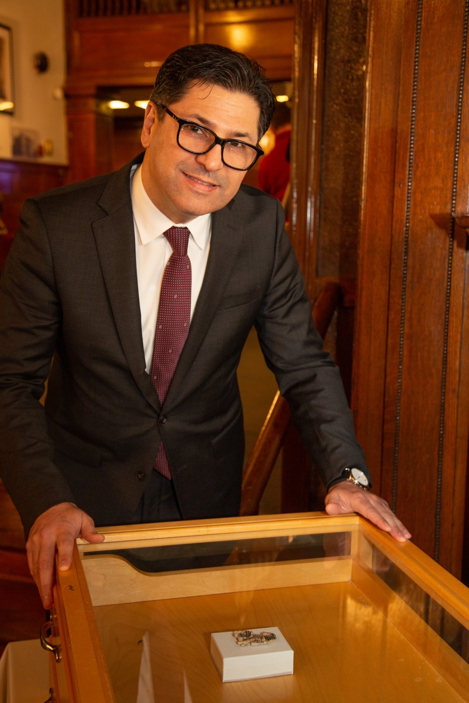 Silwan Sinarjee, the chargé d'affaires at the Embassy of the Republic of Iraq, with the artifact the FBI returned during a ceremony at the Iraq Embassy on march 8, 2023.