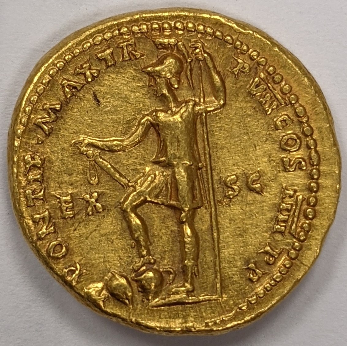 Photo depicting the back of a gold coin. The front of the coin showed the Roman emperor Nero. 