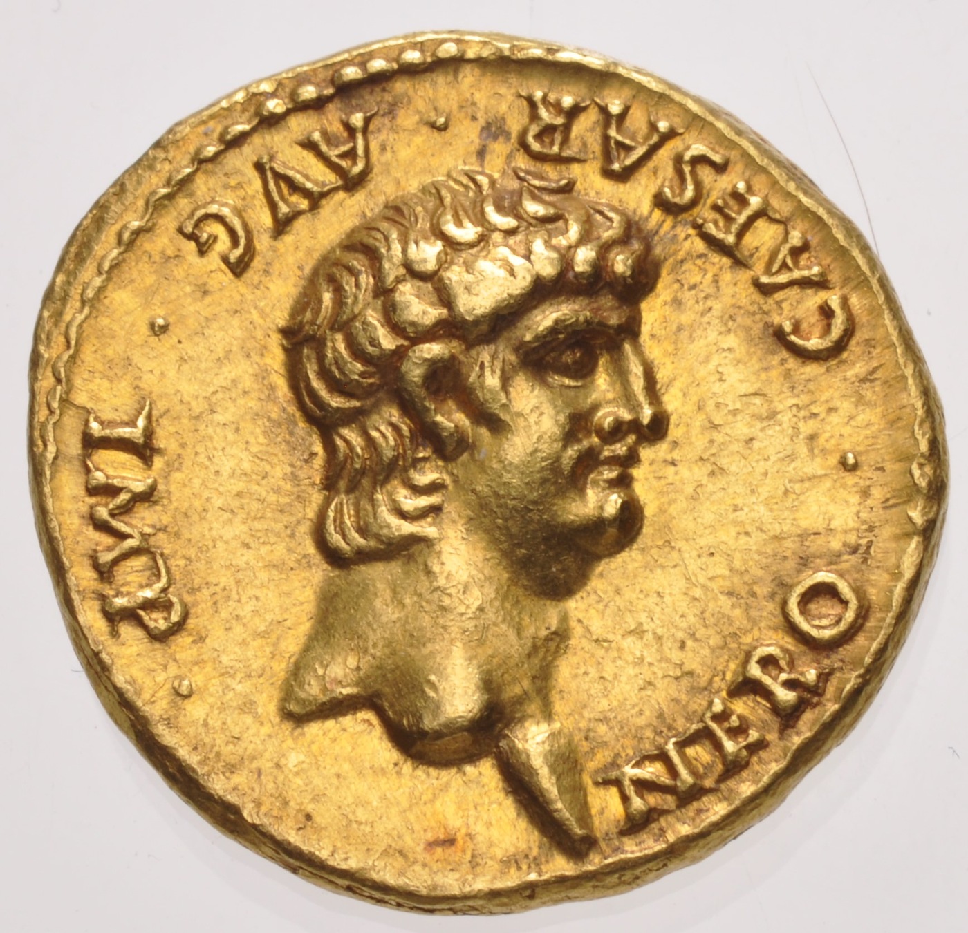 Photo depicting a gold coin that shows the head of Nero, the fifth emperor of Rome.