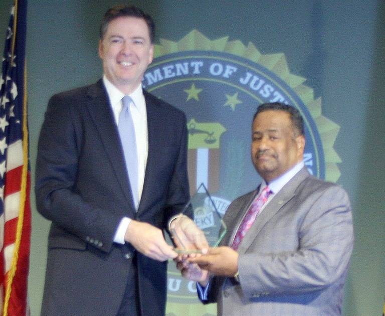Samuel Redd, Jr. Receives Director’s Community Leadership Award from Director Comey on April 15, 2016