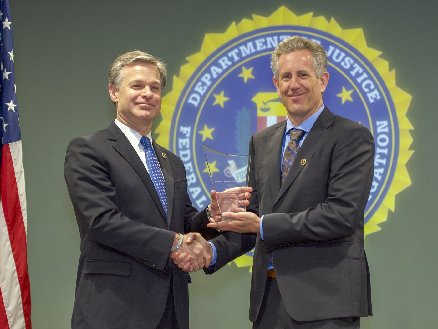 FBI Director Christopher Wray presents San Francisco Division recipient Ed Kressy with the Director’s Community Leadership Award (DCLA) at a ceremony at FBI Headquarters on May 3, 2019.
