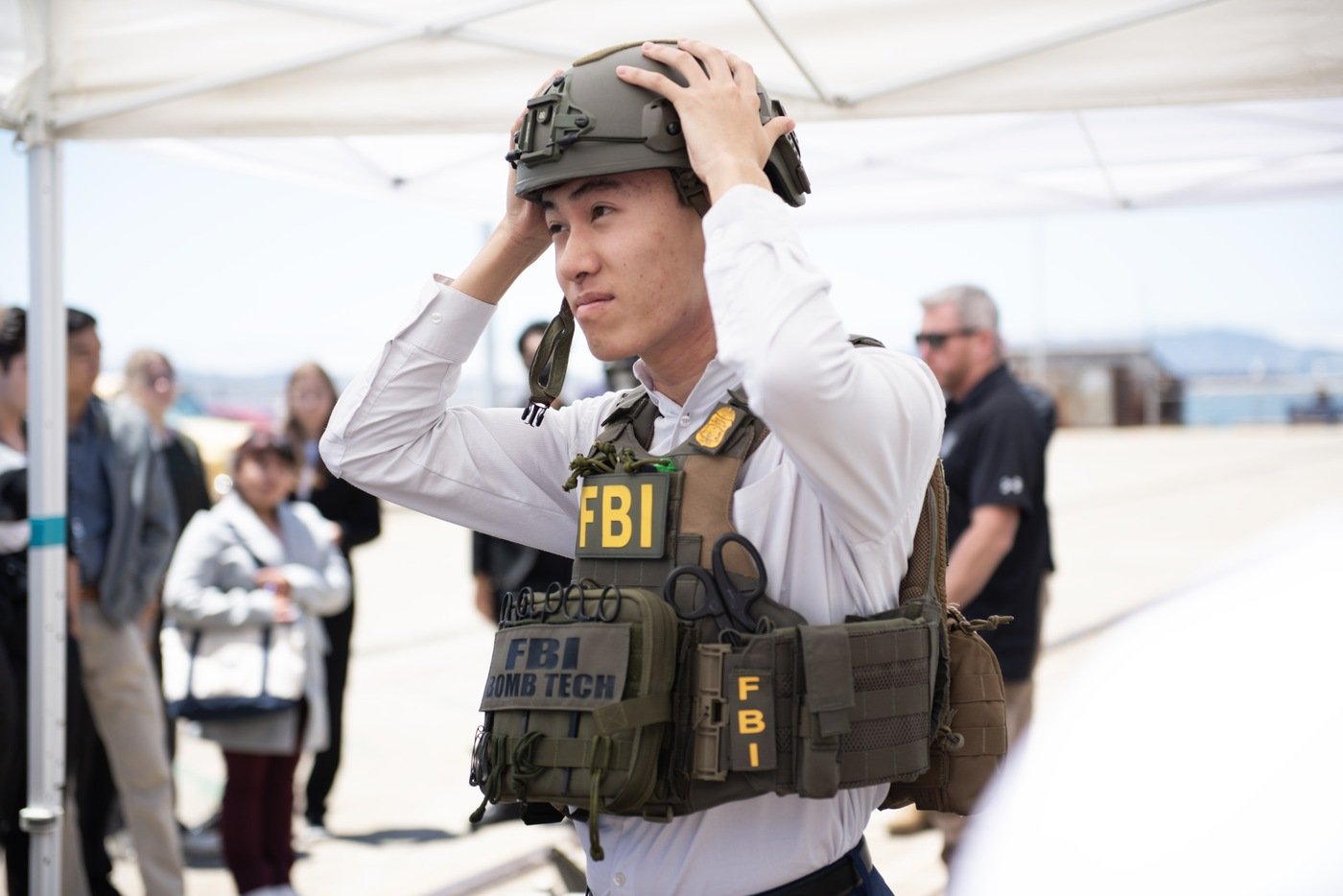 A Teen Academy student tries on bomb technician body armor and a helmet during an FBI San Francisco Teen Academy held in Alameda, California.