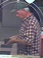 Bank robber nicknamed the Satchel Bandit who robbed two banks in California on separate days in August 2013. The suspect here is robbing the Union Bank located at 303 West Grand Avenue in Escondido, California on August 23, 2013.