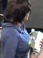 The Bombshell Bandit is believed to be responsible for robbing three bank banks, in three different cities, from June 6, 2014 to July 14, 2014. Here, she is shown robbing the Bank of the West, 27011 McBean Parkway, Valencia, California, on Thursday, July 3, 2014.