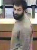 Suspect robbing the Wells Fargo Bank, 685 Saturn Boulevard, San Diego, California, on Tuesday, October 7, 2014. The Bearded Bandit is also responsible for robbing the Chase Bank branch located at 1641 South Melrose Drive in Vista, California, on Wednesday, October 15, 2014.