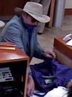 Suspect robbing the Union Bank branch at 16880 Bernardo Center Drive in San Diego, California, on Friday, November 14, 2014.