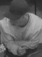 Suspect robbing the Wells Fargo Bank at 7544 Girard Avenue, La Jolla, California, on Wednesday, November 26, 2014. On November 28, 2014, the Chit Chat Bandit also allegedly robbed the Wells Fargo Bank located inside the Vons grocery store at 13439 Camino Canada in El Cajon, California.