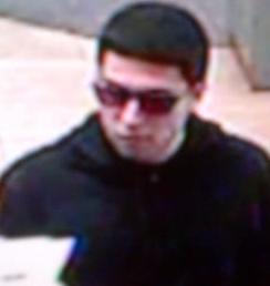 The Risky Business Bandit is believed to be responsible for robbing four banks from April 18, 2014 to Friday, July 25, 2014. Here, he is shown robbing the San Diego County Credit Union, 12330 Carmel Mountain Road, San Diego, California, Friday, July 25, 2014.