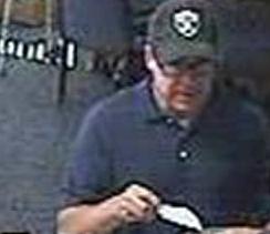 Suspect robbing the U.S. Bank, located at 7700 Carlsbad Village Drive, Carlsbad, California on Tuesday, August 5, 2014. The robber, nicknamed The Hills Bandit, also robbed three banks in the Los Angeles area; one Wells Fargo Bank in on May 16, 2014, and two Citi Banks on July 16, 2014, and July 25, 2014.