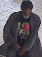 Suspect robbing the San Diego Metropolitan Credit Union, located at 320 B Street, San Diego, on Tuesday, August 11, 2015.