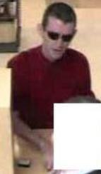 Unknown suspect robbing the U.S. Bank, located inside of Albertsons grocery store, 1133 South Mission Road, Fallbrook, California, on Friday, September 25, 2015.