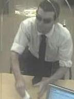 Suspect robbing the U.S. Bank, located inside of the Albertsons grocery store at 8920 Fletcher Parkway, La Mesa, California, on Thursday July 2, 2015.