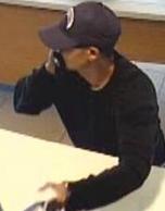 Suspect robbing the Mission Federal Credit Union, located at 269 West Washington Street, San Diego, California, on Wednesday, September 16, 2015.