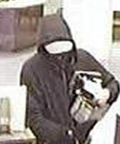 Suspect robbing the U.S. Bank branch, located at 2520 El Camino Real in Carlsbad, California, on Tuesday, January 6, 2015.