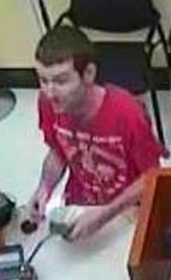 The so-called Hipster Bandit robbing the Wells Fargo Bank at 10675 Scripps Poway Parkway in San Diego, California, on Monday, November 2, 2015.