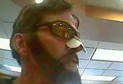 Unidentified bank robber believed to be responsible for at least six bank robberies in the city of Everett, Washington from June 1, 2015 to October 30, 2015.