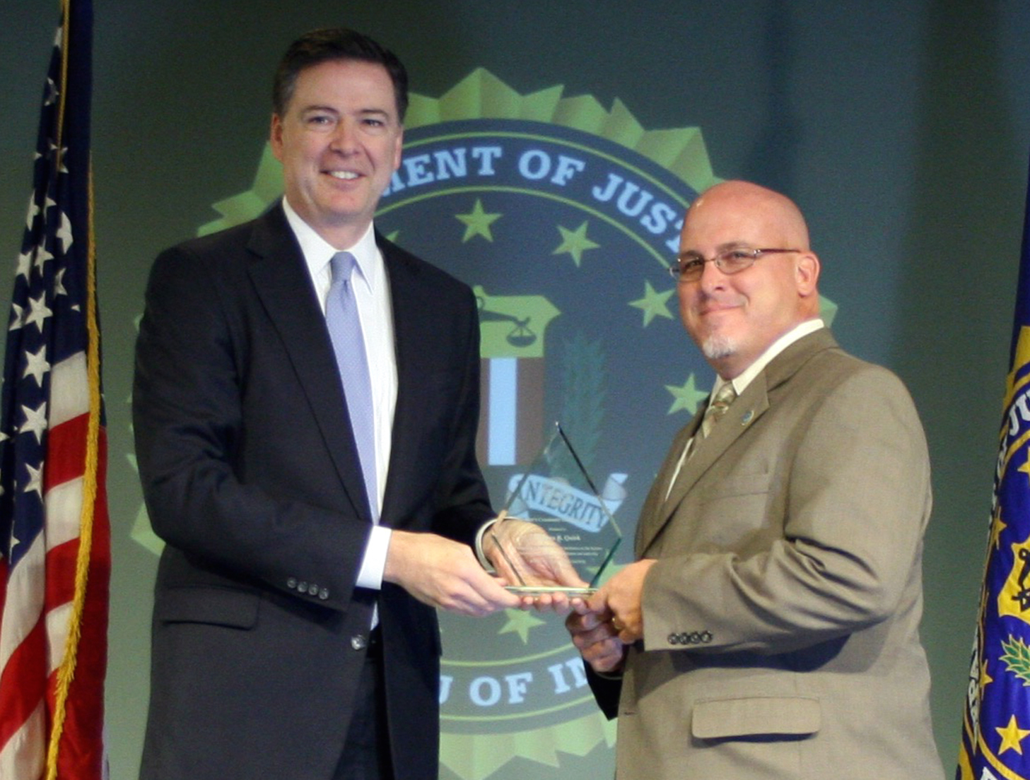 Stephen B. Quirk Receives Director’s Community Leadership Award from Director Comey on April 15, 2016