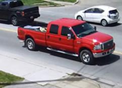 Red extended cab pick-up truck used to abduct an adult female from South County Park in Cape Girardeau on May 12, 2015. The photos were taken in Anna, Illinois. There appears to be a large dent on the rear quarter panel behind rear tire on the passenger side.