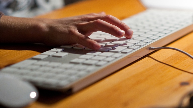 Man Typing on Keyboard (Stock Image) Man Typing on Keyboard (Stock Image)