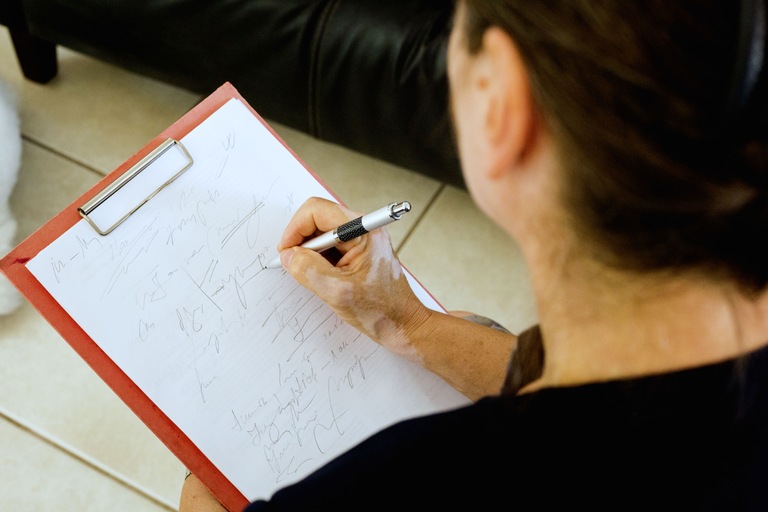Therapist Taking Notes - Getty Stock Image