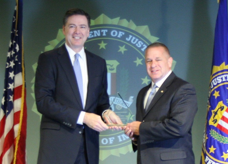 Tom Bowers Receives Director’s Community Leadership Award from Director Comey on April 15, 2016