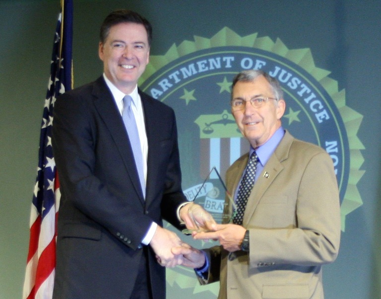 Tom Hinz Receives Director’s Community Leadership Award from Director Comey on April 15, 2016