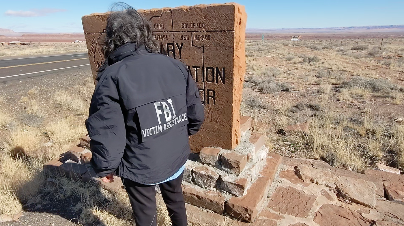 Victim Specialist Blanda Preston at a Navajo Nation boundary line in Arizona.