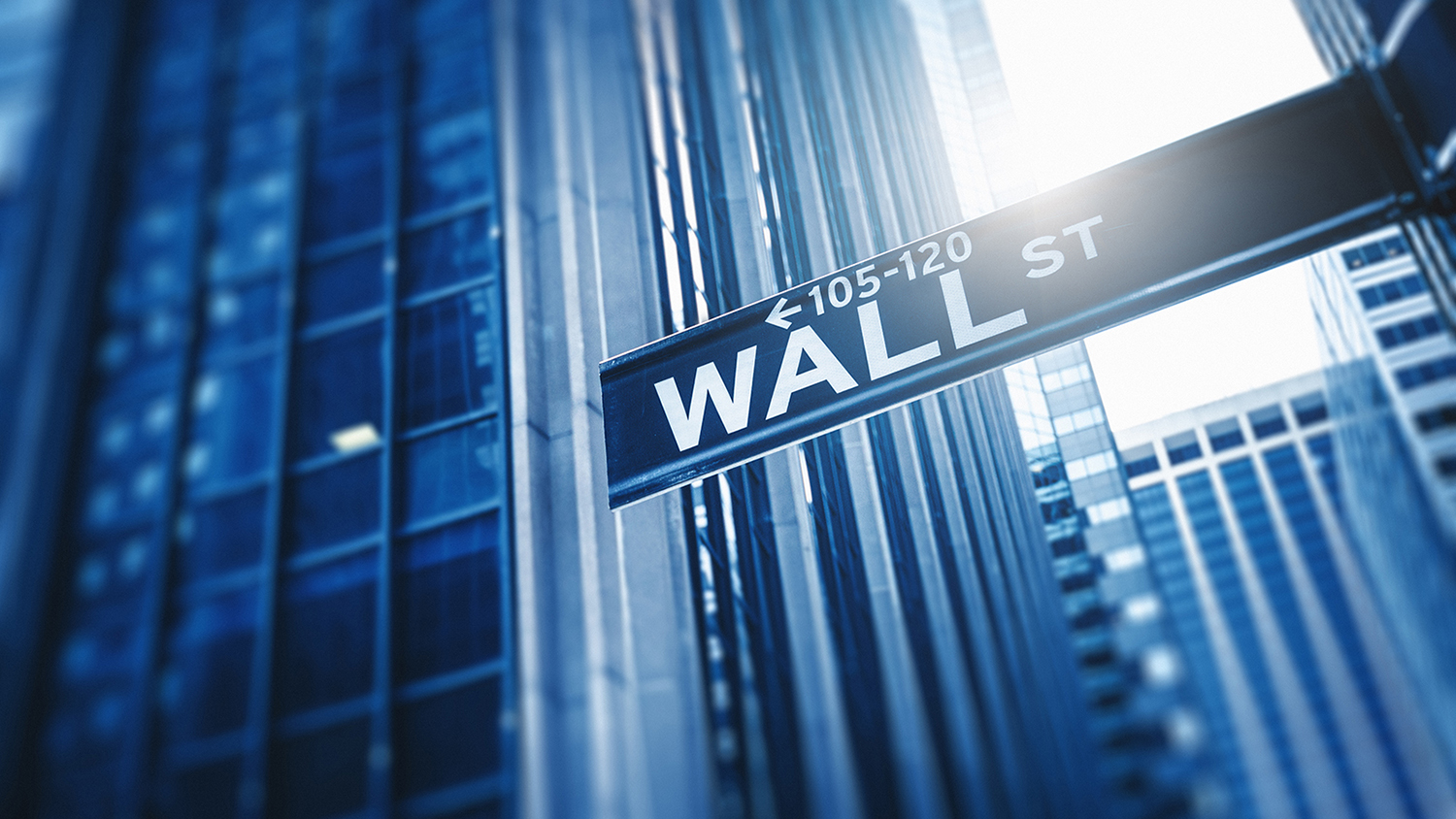 Stock image of a street sign for Wall Street in New York City.