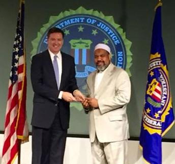 On April 15, 2016, the ADAMS Center’s Imam Mohamed Magid attended a ceremony at FBI Headquarters where he, along with recipients from across the country, was presented with the award by FBI Director James B. Comey.