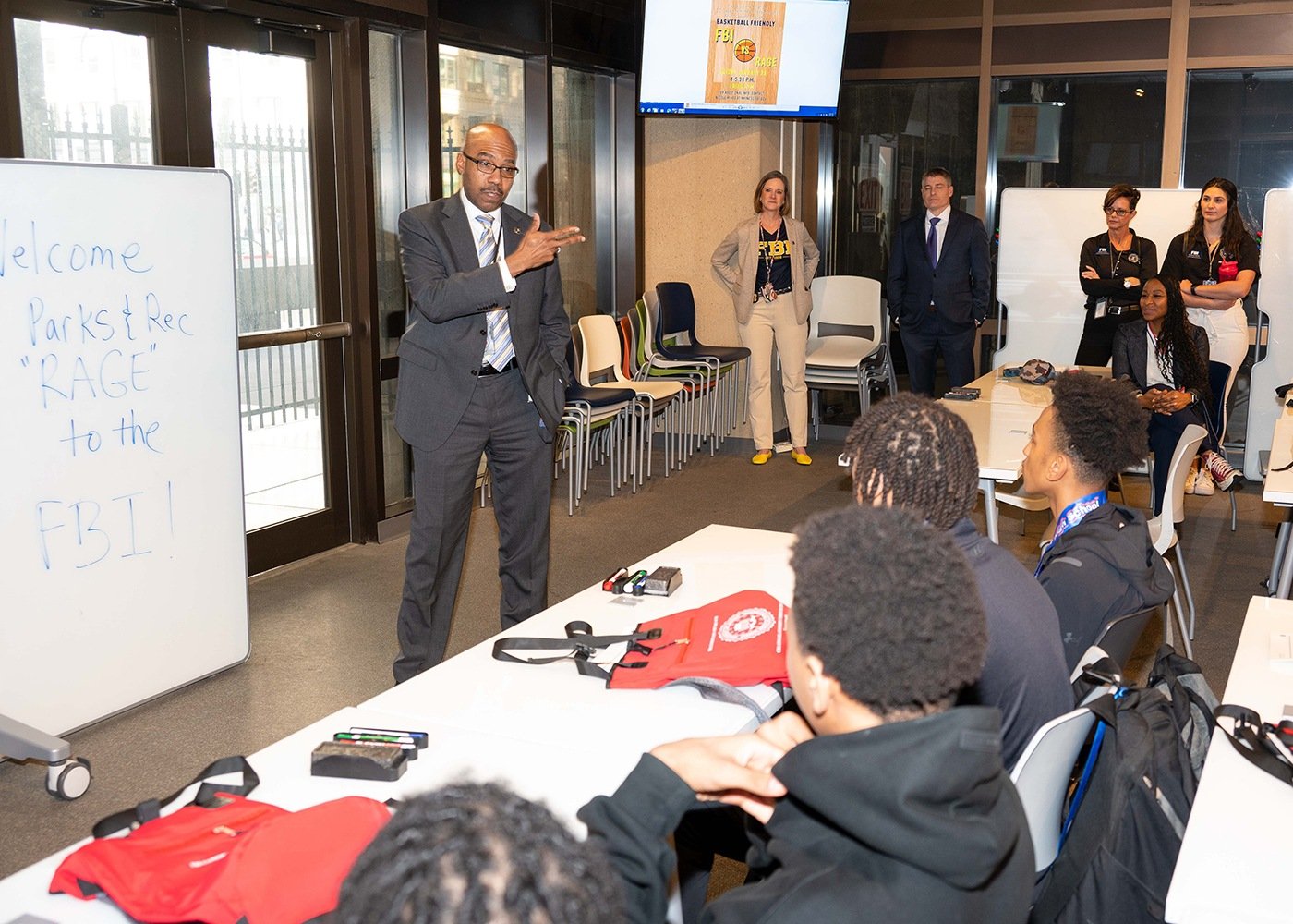 Robert Contee, assistant director of the Office of Partner Engagement, addresses teens during a WFO community outreach event at FBI Headquarters on January 24, 2024.