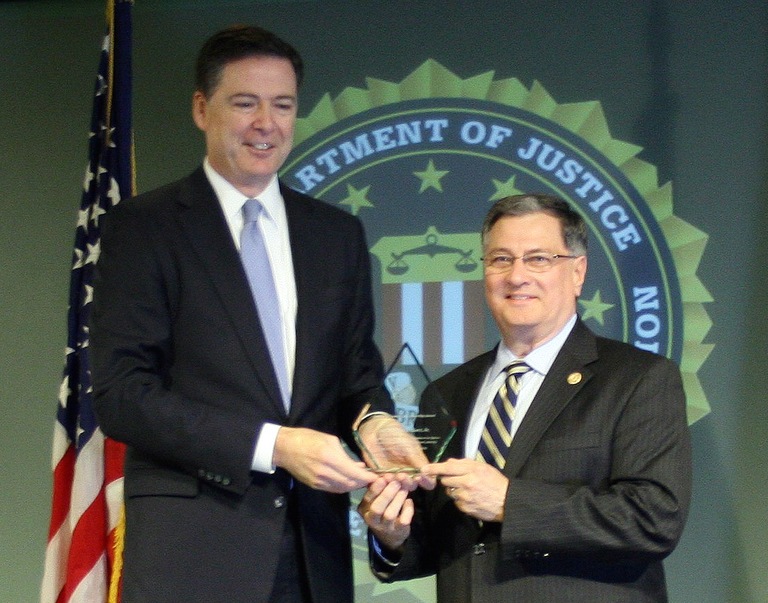 Dr. William H. Kerr, Jr. Receives Director’s Community Leadership Award from Director Comey on April 15, 2016
