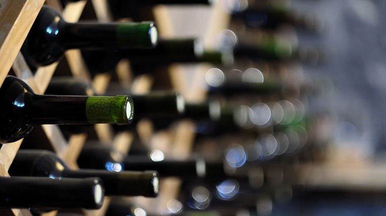 Wine Bottles in Rack (Stock Image)